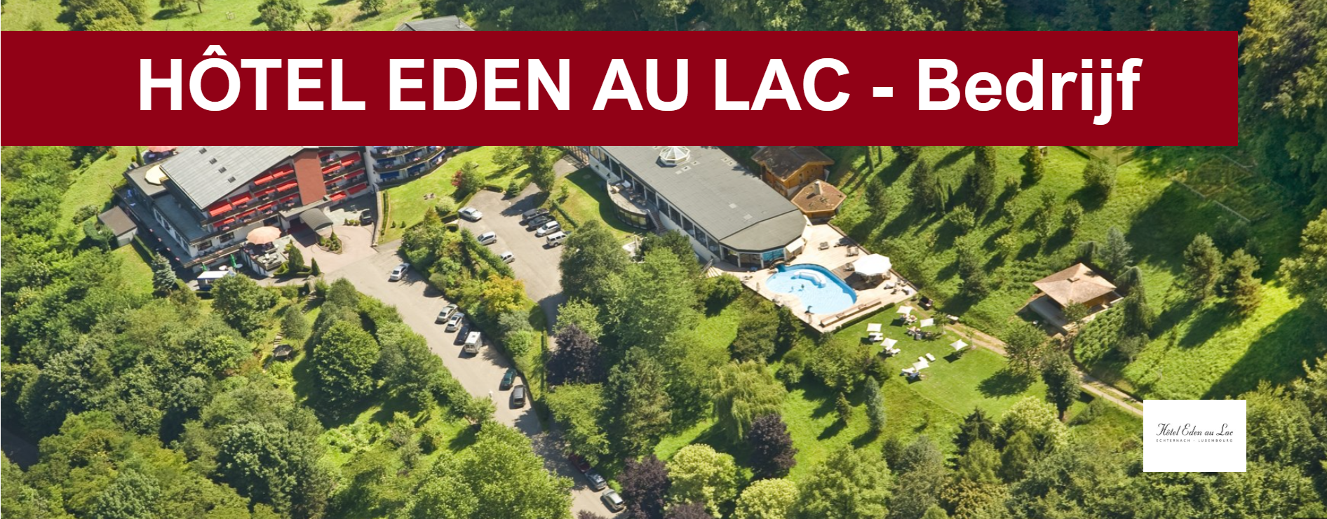 Vue aérienne de l'Hôtel Eden au Lac, niché dans un écrin de verdure avec piscine.