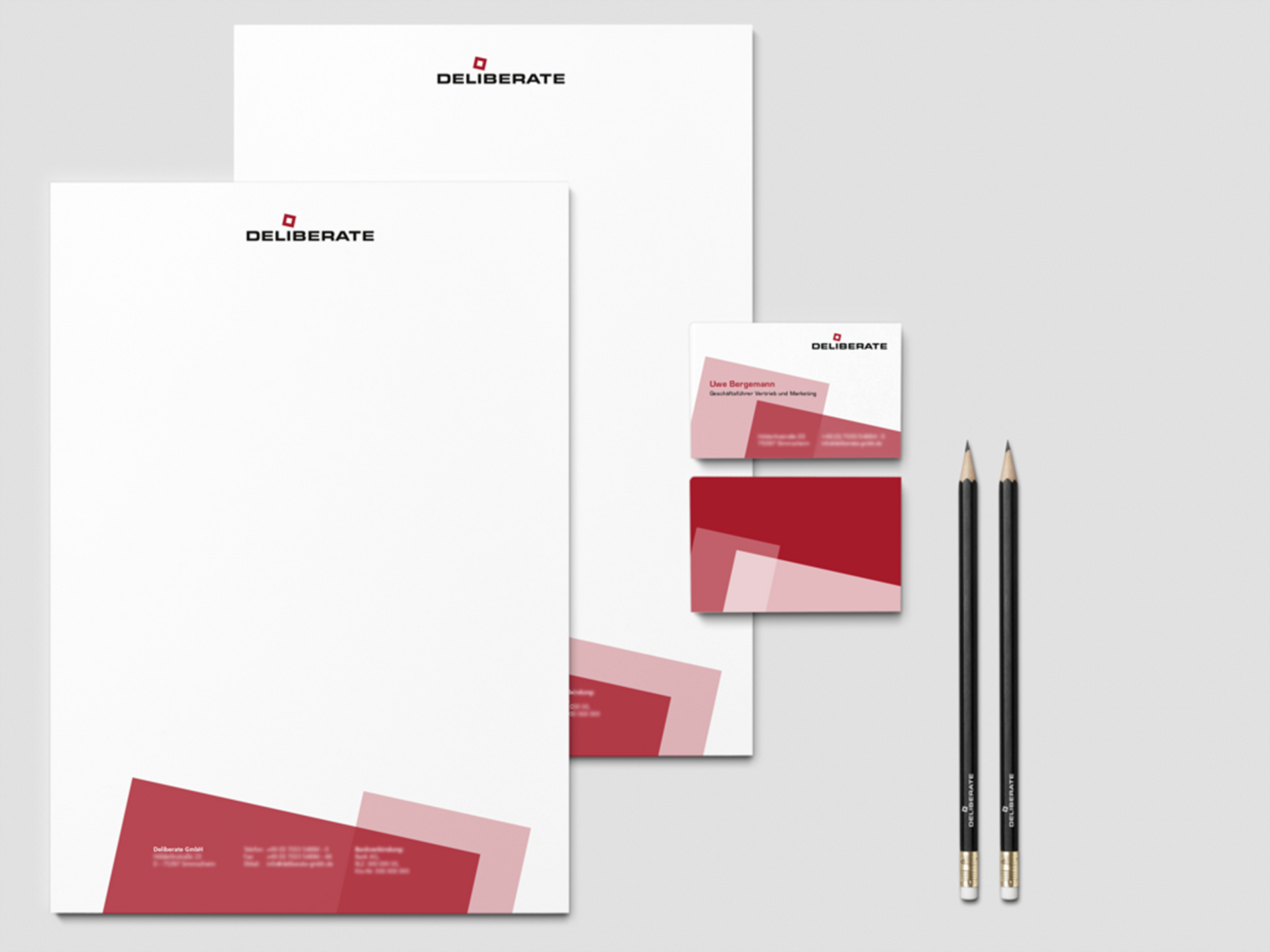 Business stationery for Deliberate, an IT hosting service featuring clear visual hierarchy and bold colors 