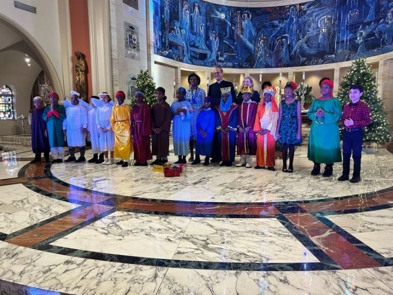 A group of people dressed in costumes are posing for a picture.