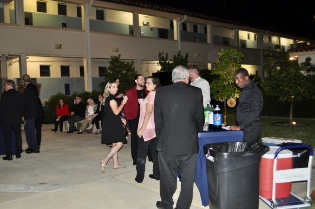 A group of people standing in front of a building