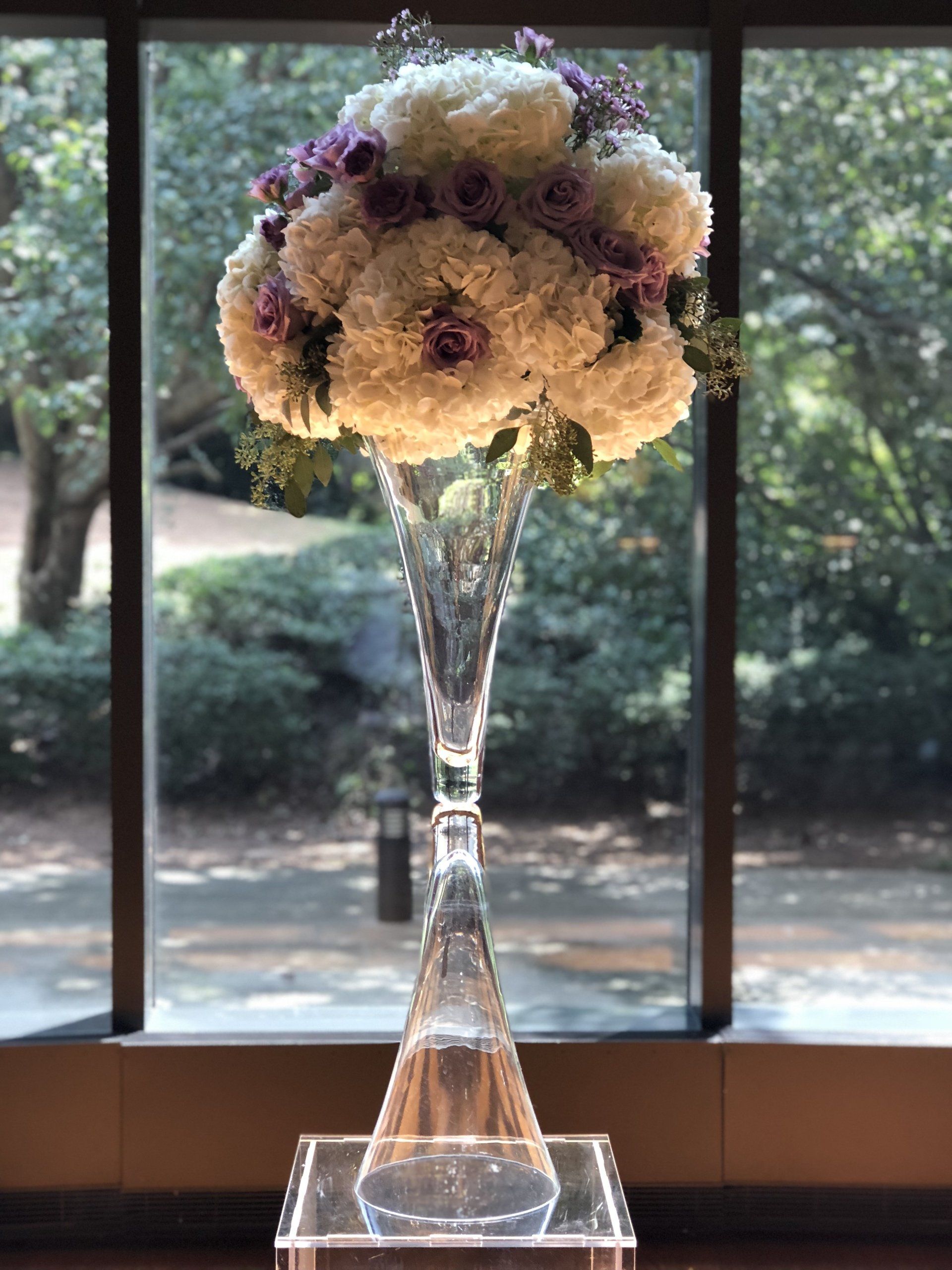 Floral bouquet in a modern and elegant tall vase.