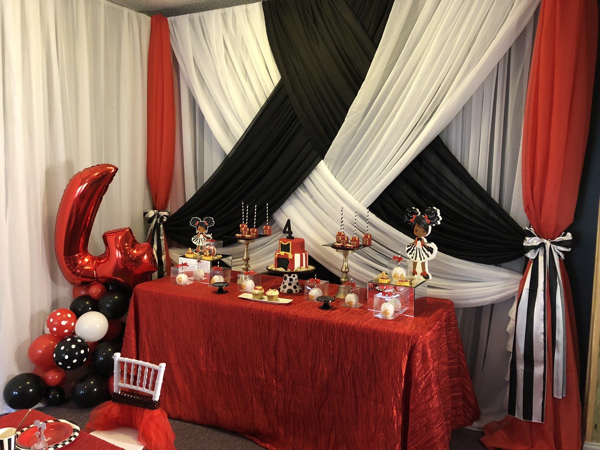 Beautiful custom backdrop with a crisscross draping design.