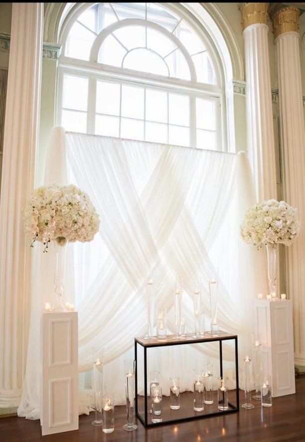 Elegant one color backdrop draping with a crisscross design.