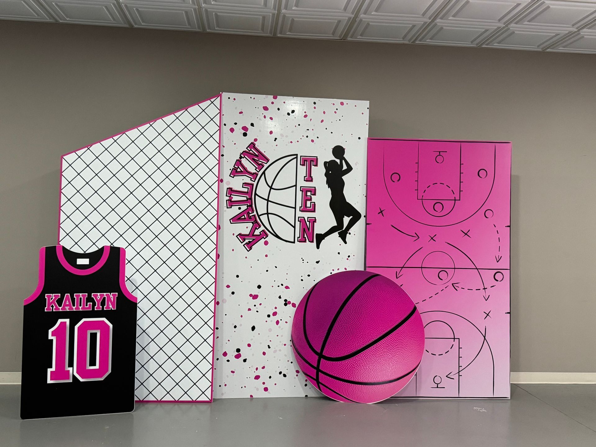 Pink basketball themed custom backdrop with jersey display and court graphics for girls sports birthday party