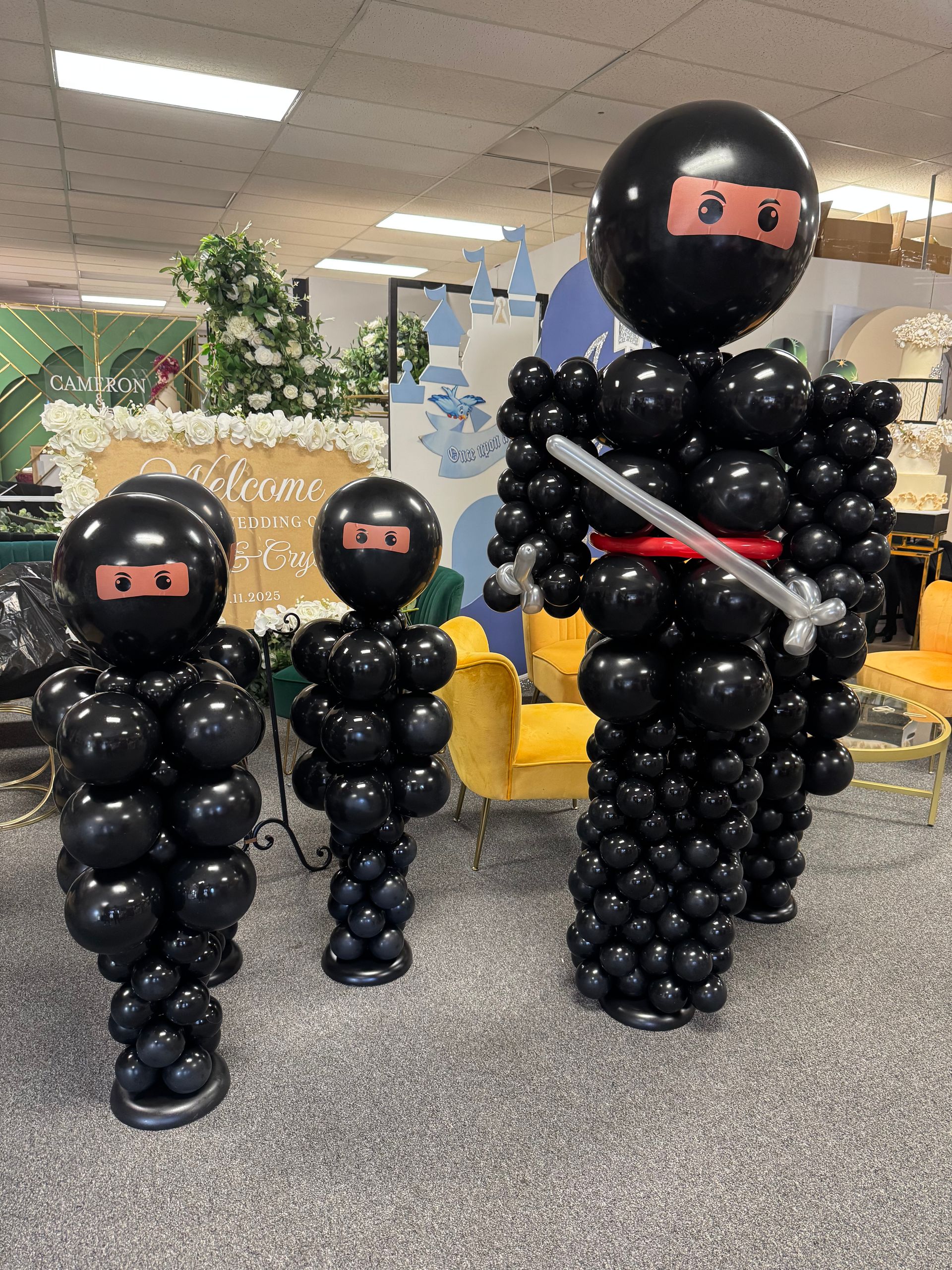 Black ninja balloon sculpture character for kids ninja themed birthday party decor and interactive photo prop