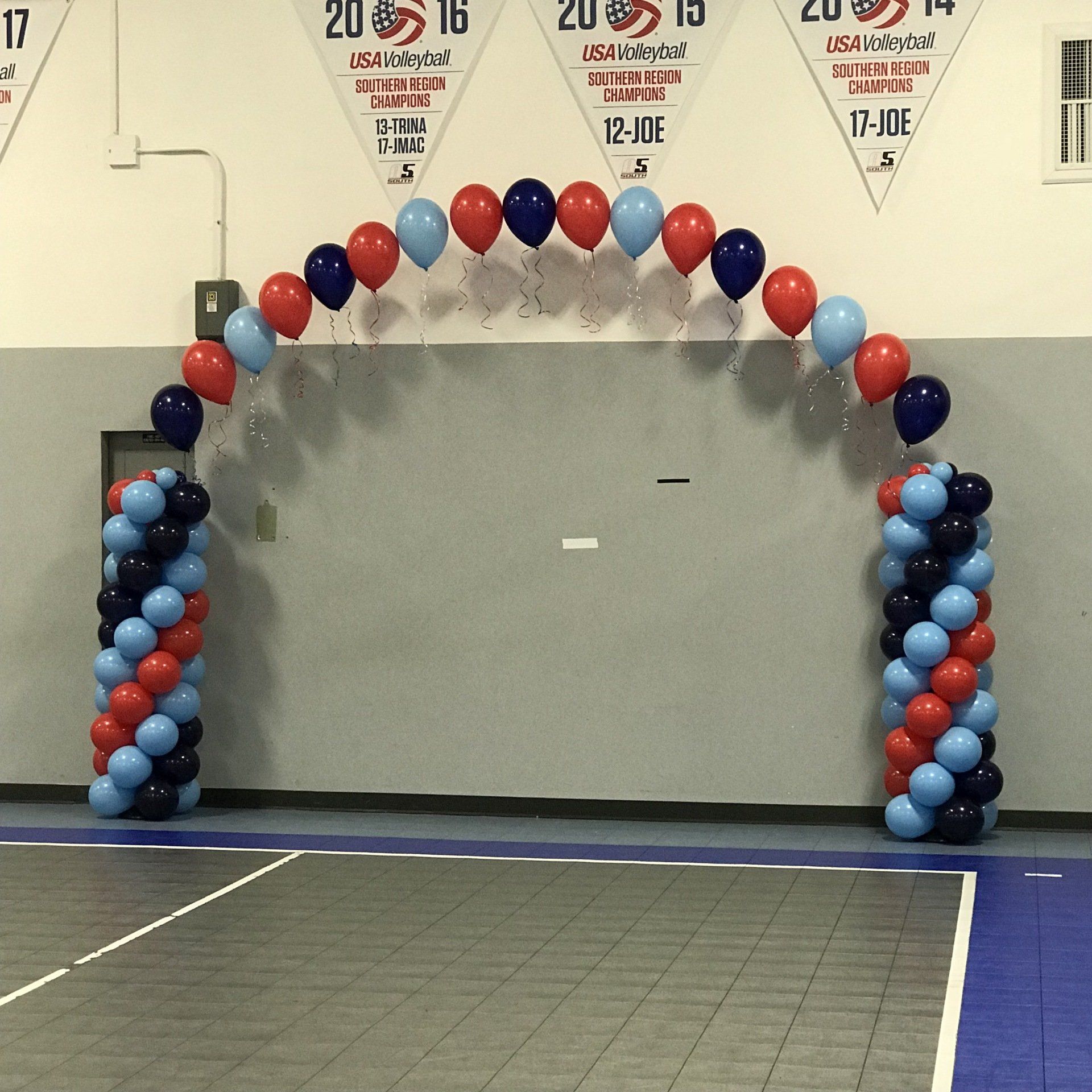 Two columns/anchors along with balloons in multiple colors create a beautiful archway.