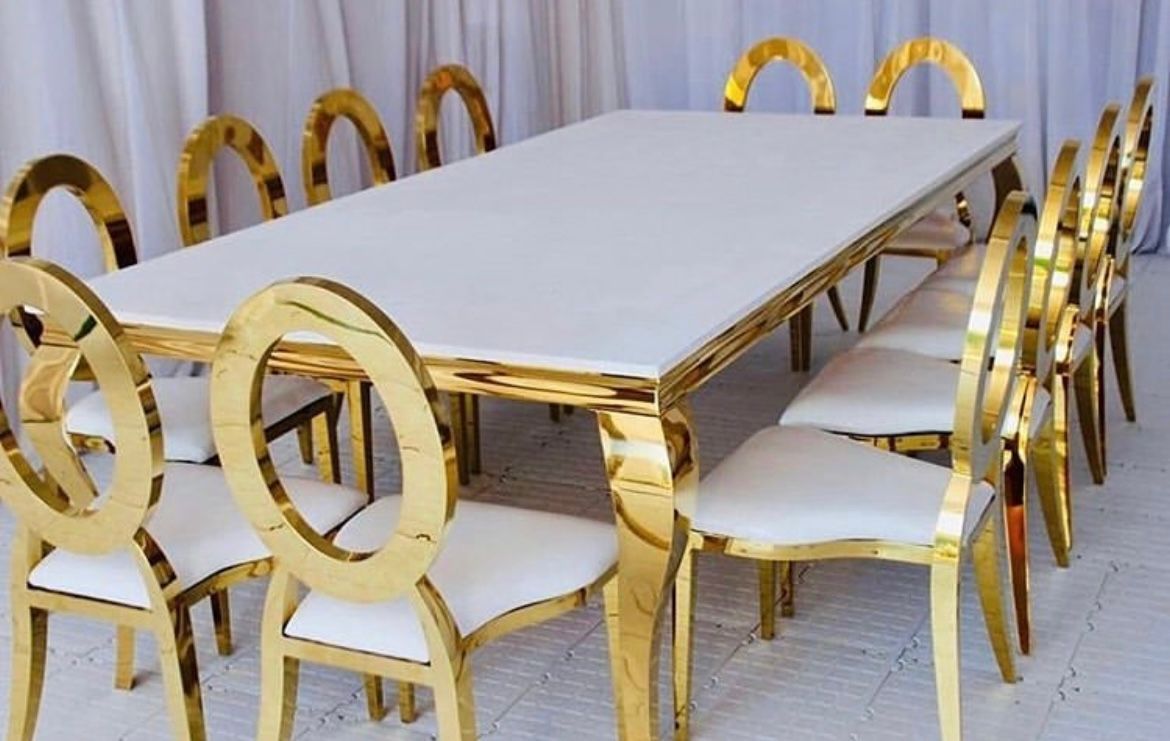 A kids throne and a love seat in the style of a throne; both have gold trim.