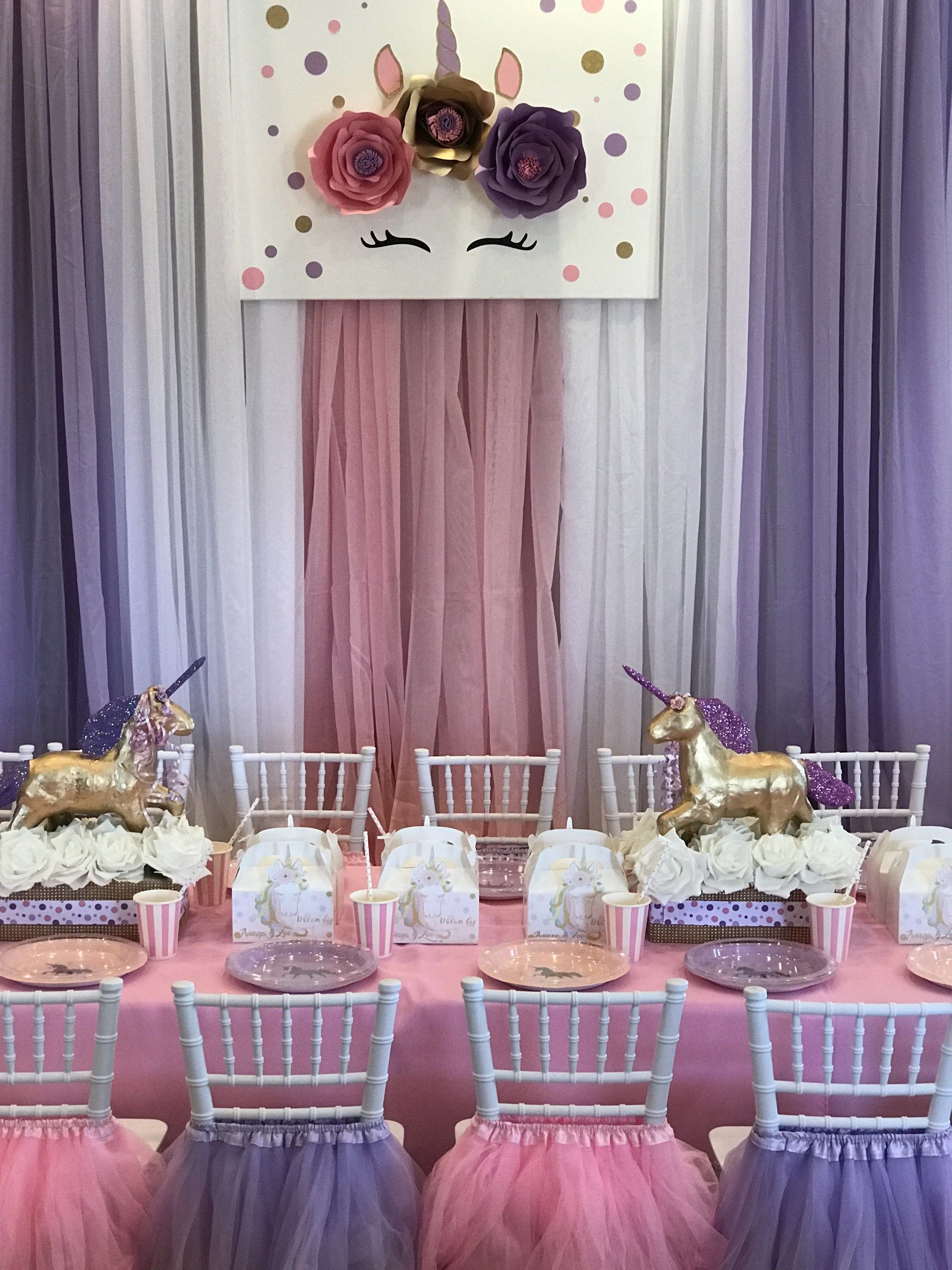 Multi color draping design with a unicorn art piece.