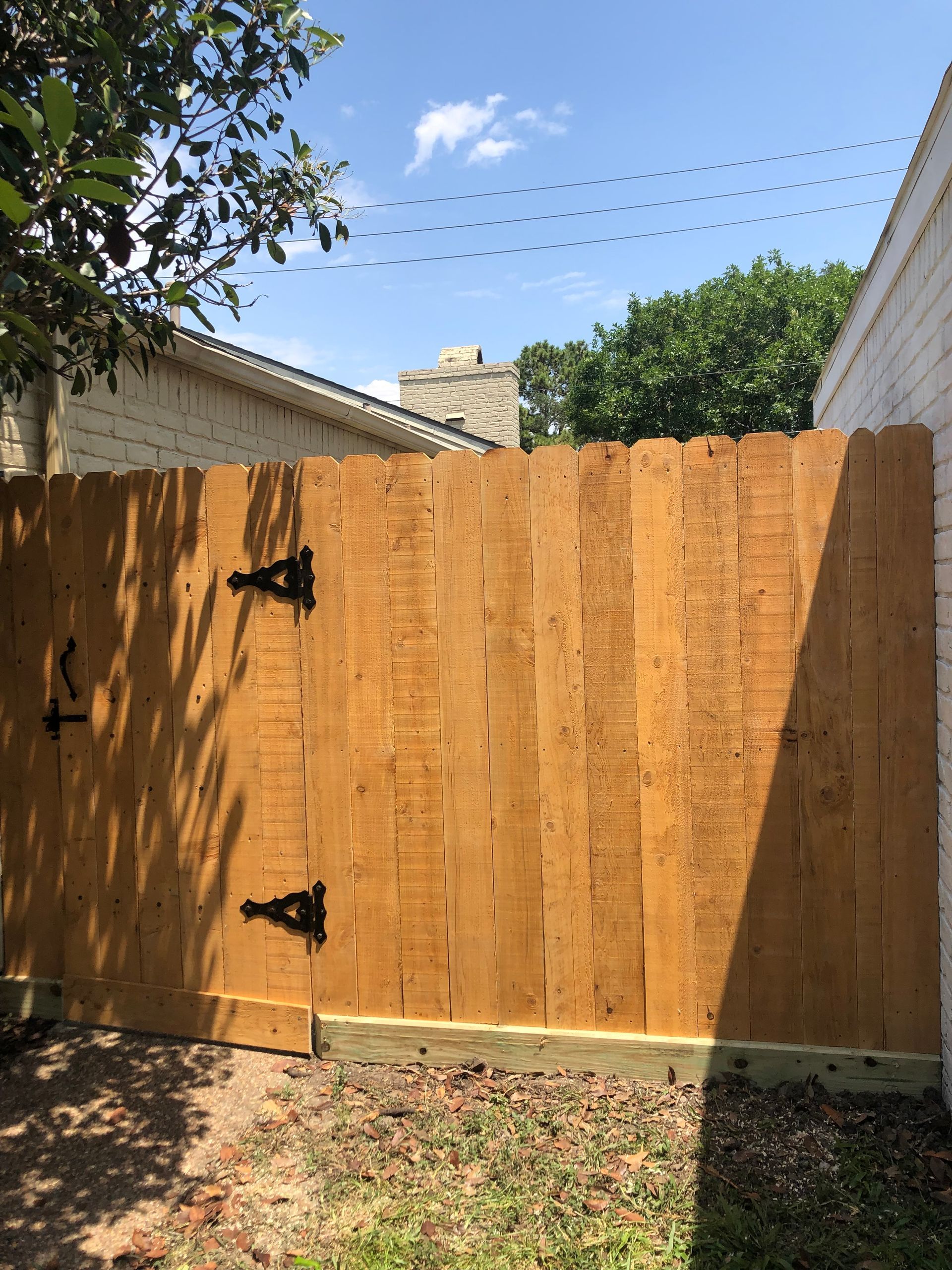 A man is painting a ceiling with a spatula.
