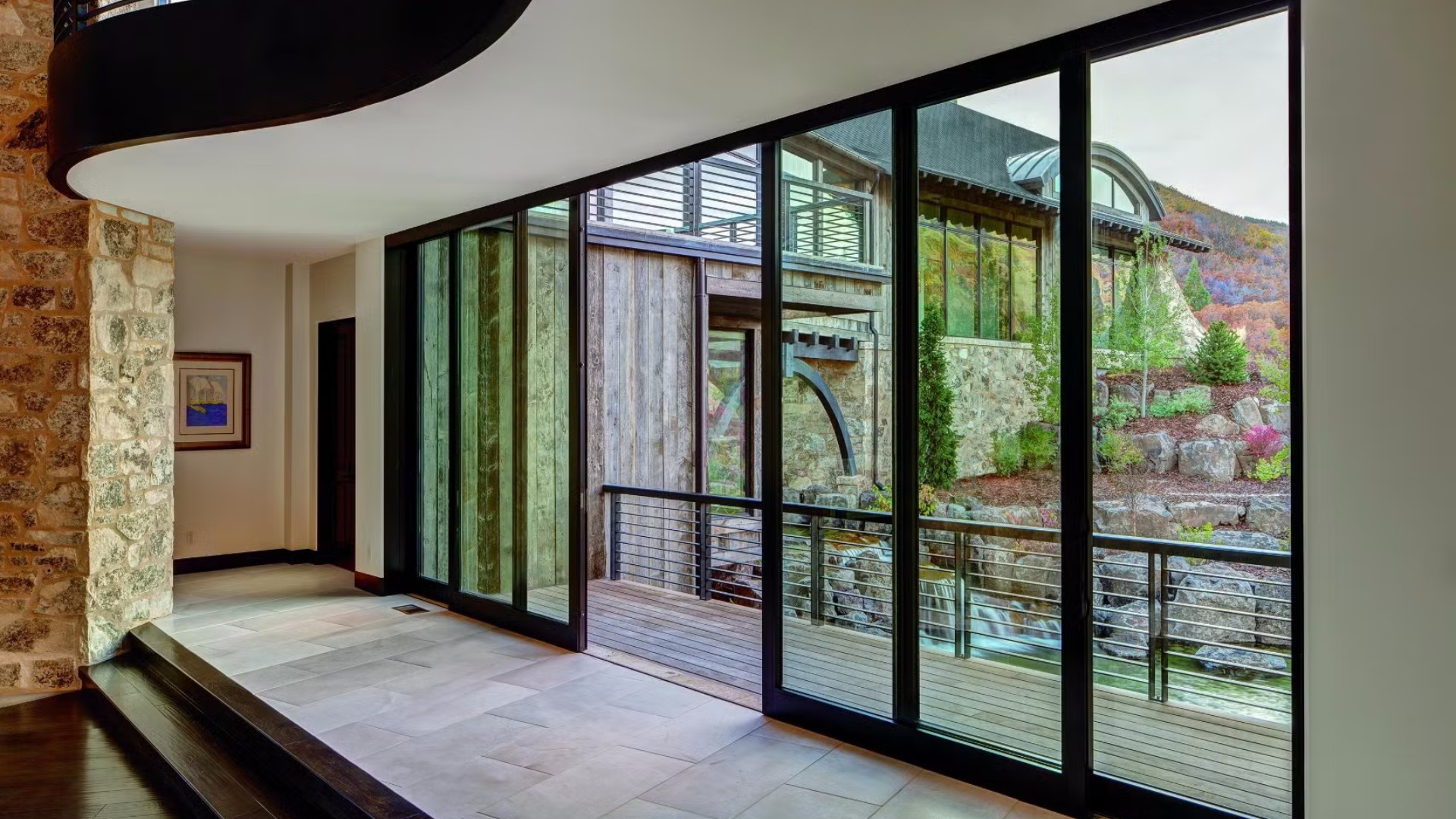 A hallway with a lot of windows and a staircase