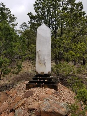 A woman praying at Enlightened Life Temple in Denver, CO