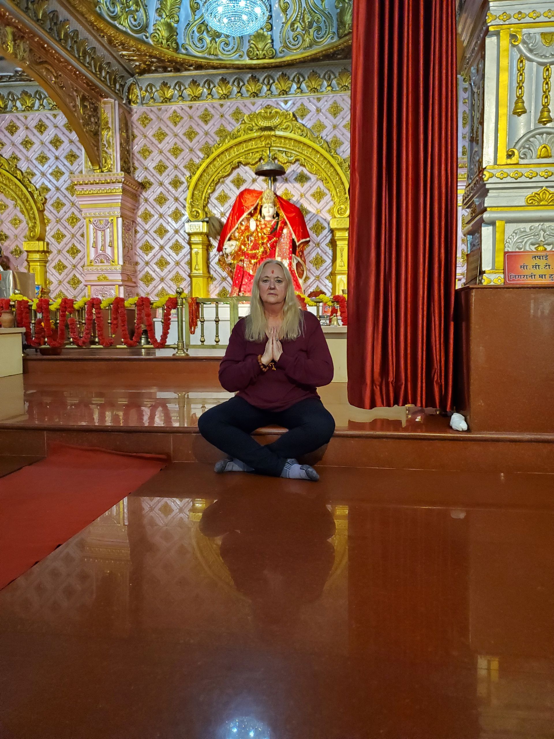 Three lit candles at Enlightened Life Temple in Denver, CO