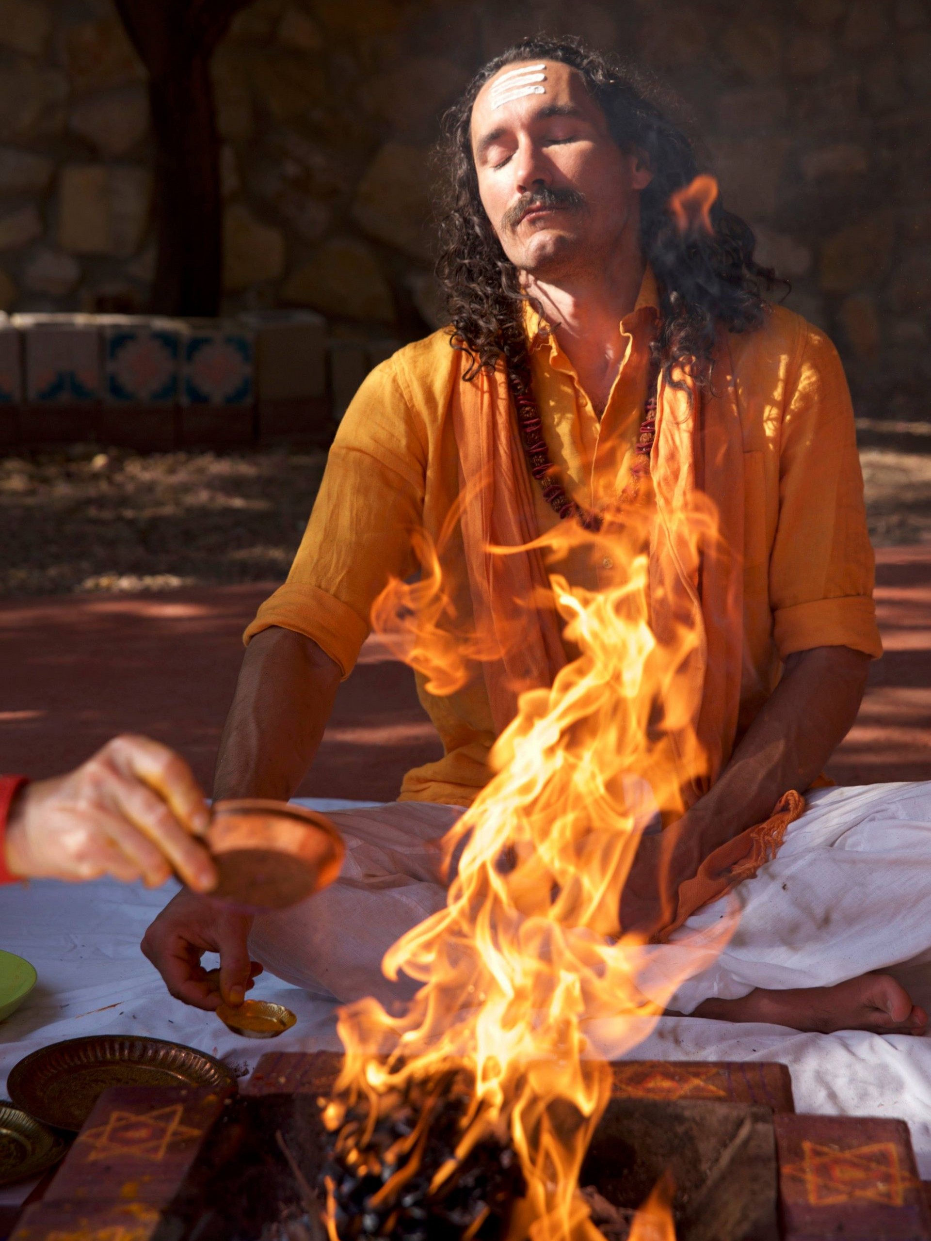 A woman praying at Enlightened Life Temple in Denver, CO