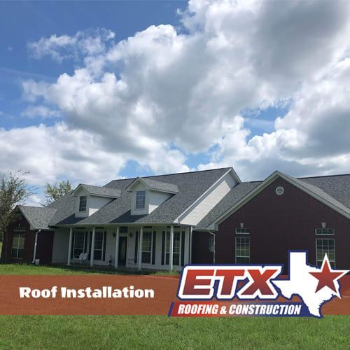 A house with a roof that has been installed by etx roofing and construction