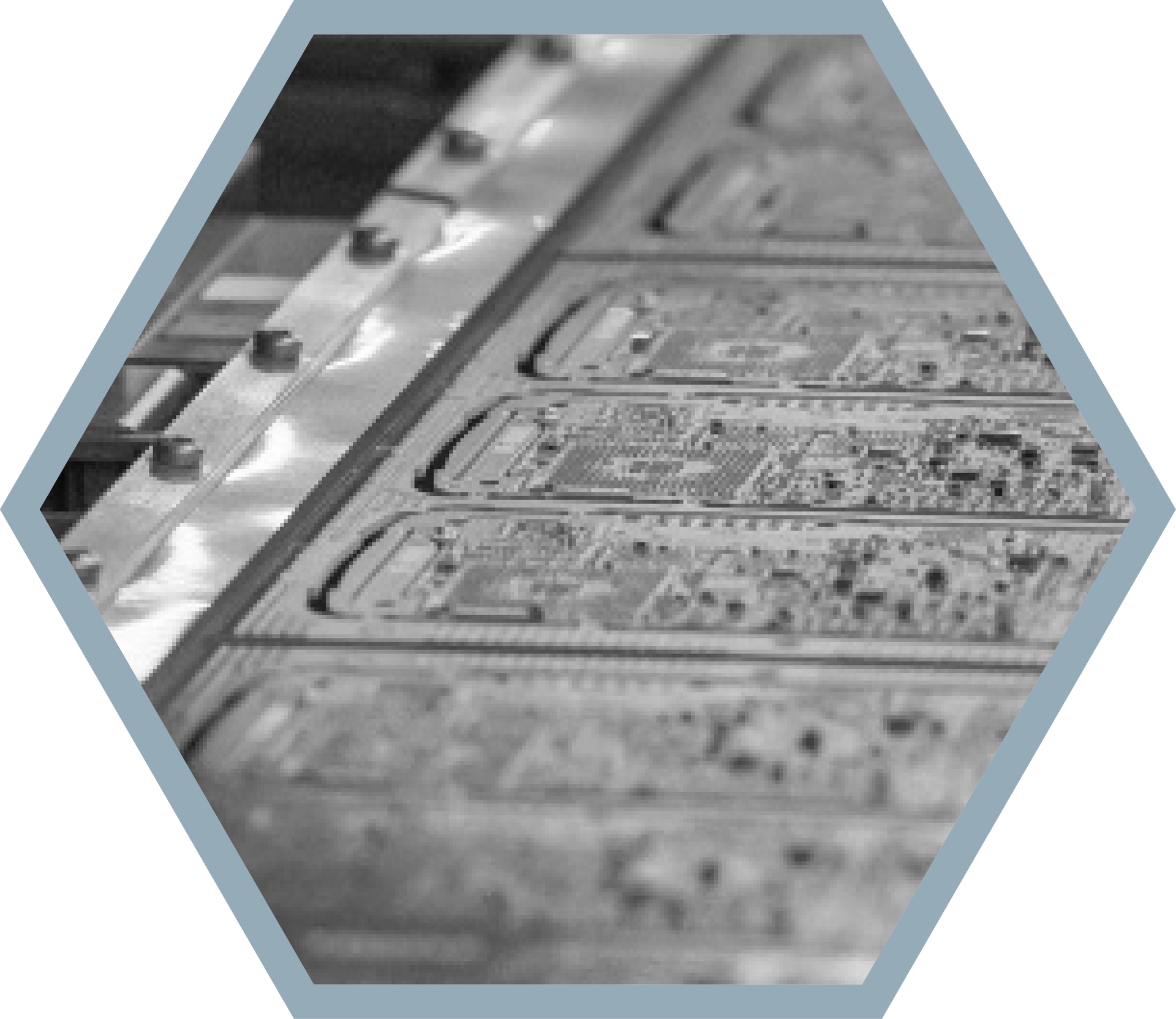 Circuit boards in a manufacturing tray, with metal framework.
