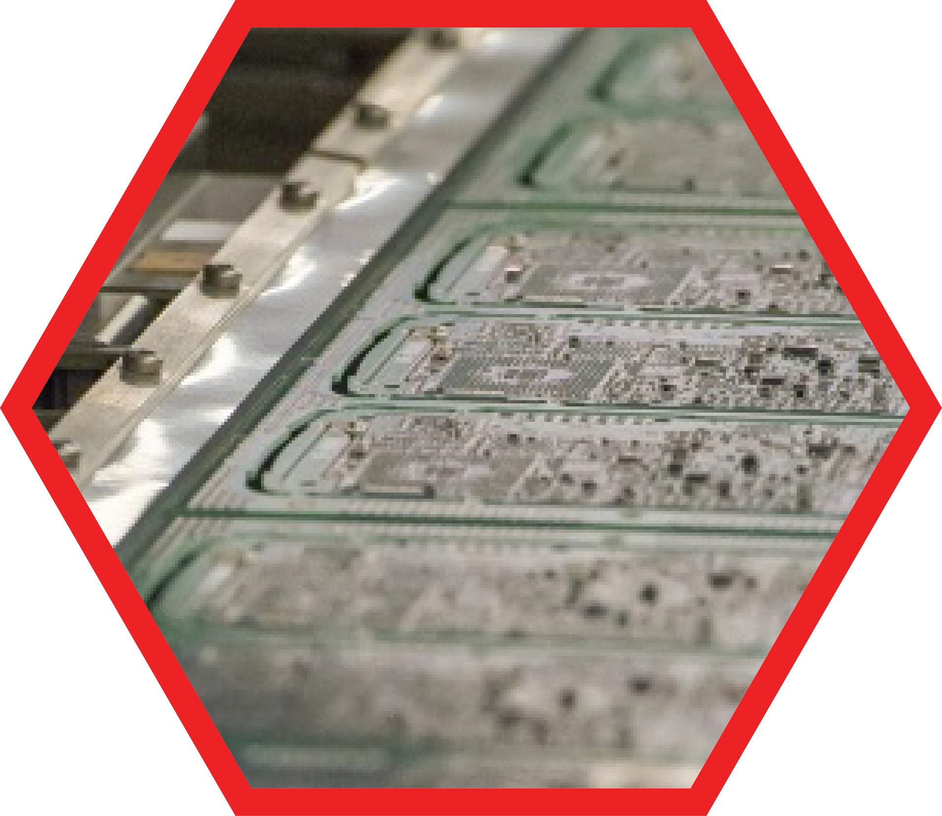 Printed circuit boards on a conveyor belt in an industrial setting.