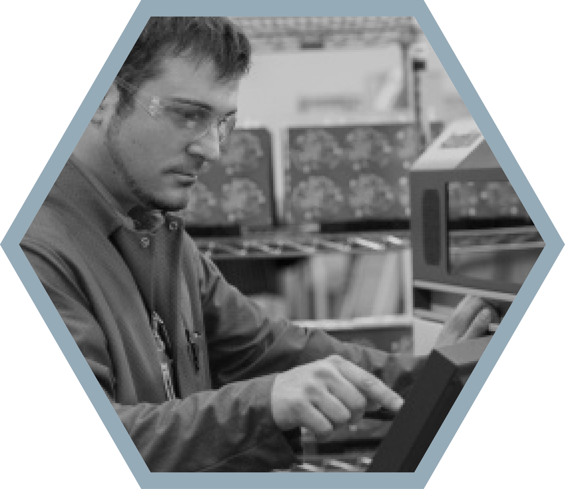 Man in safety glasses operating machinery.