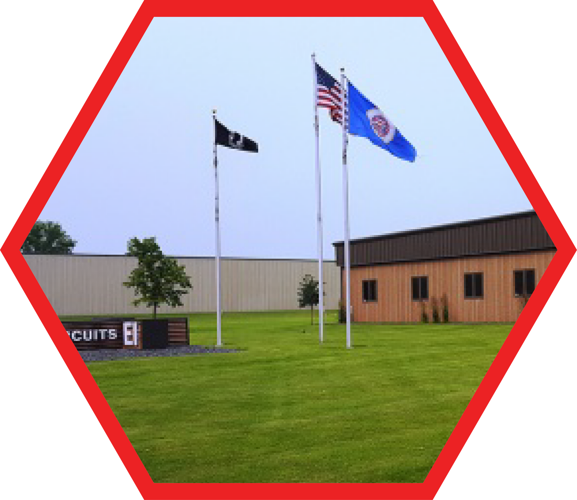 Building with flags: American, Minnesota, and black flag. Sign