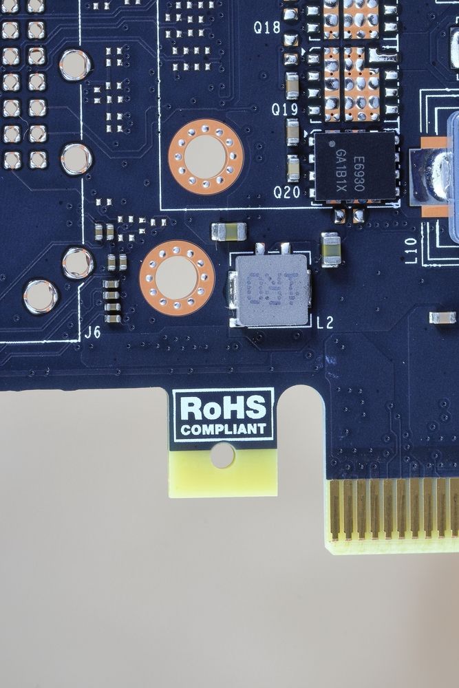 Close-up of a black circuit board with electronic components, featuring a