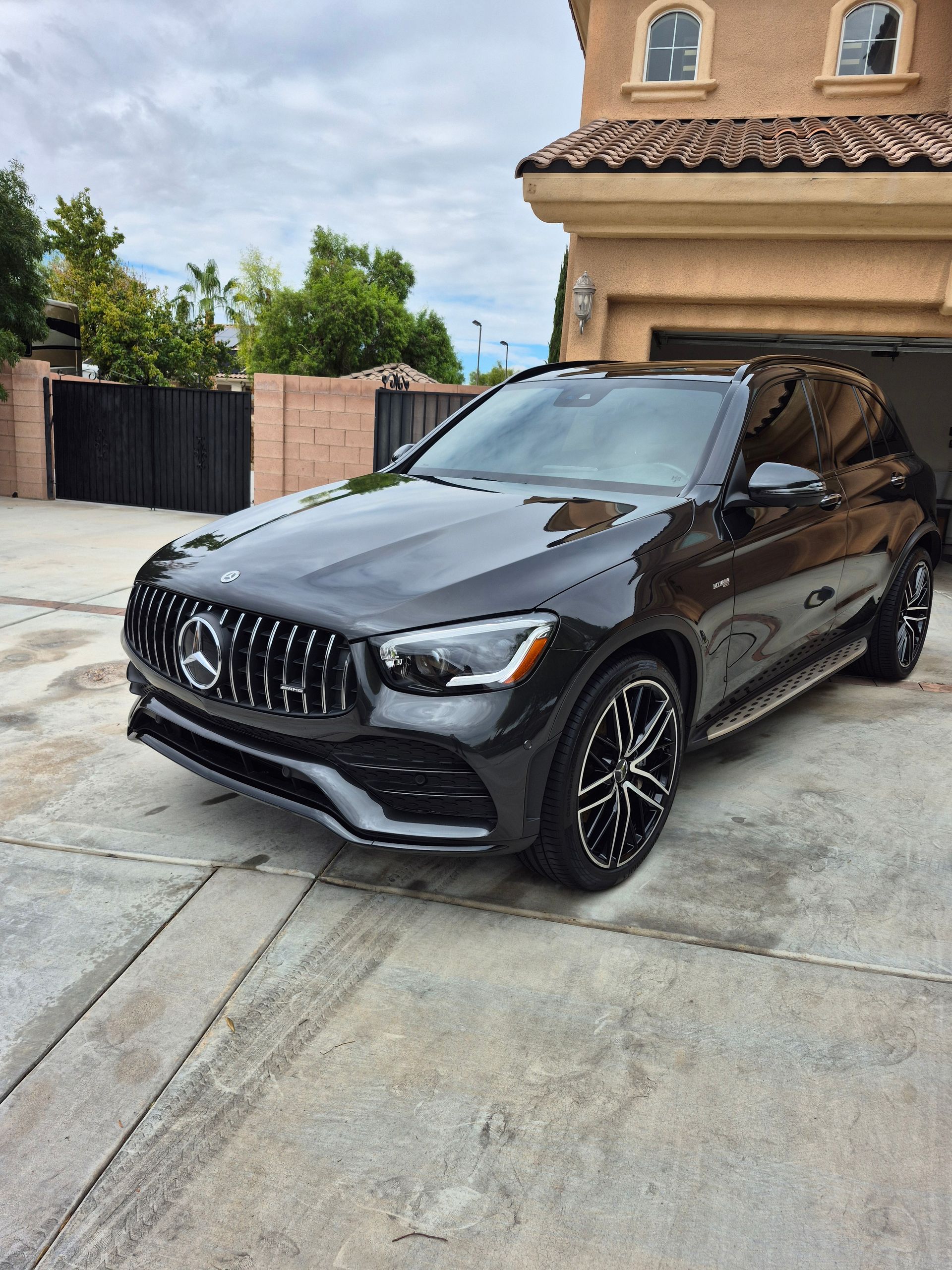 Silver Hyundai Elantra parked on a street in front of a house.