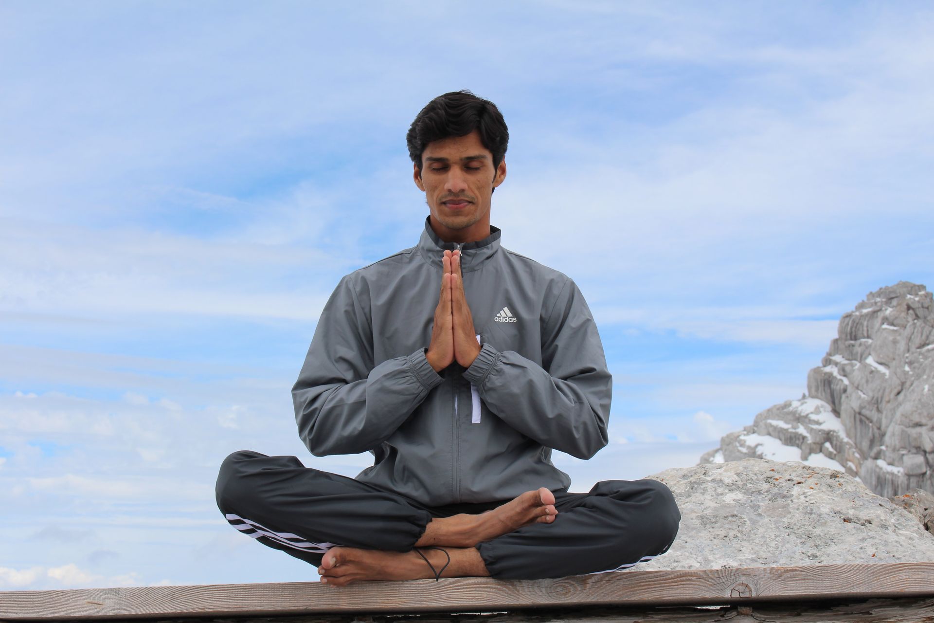 Young man sitting in the lotus position