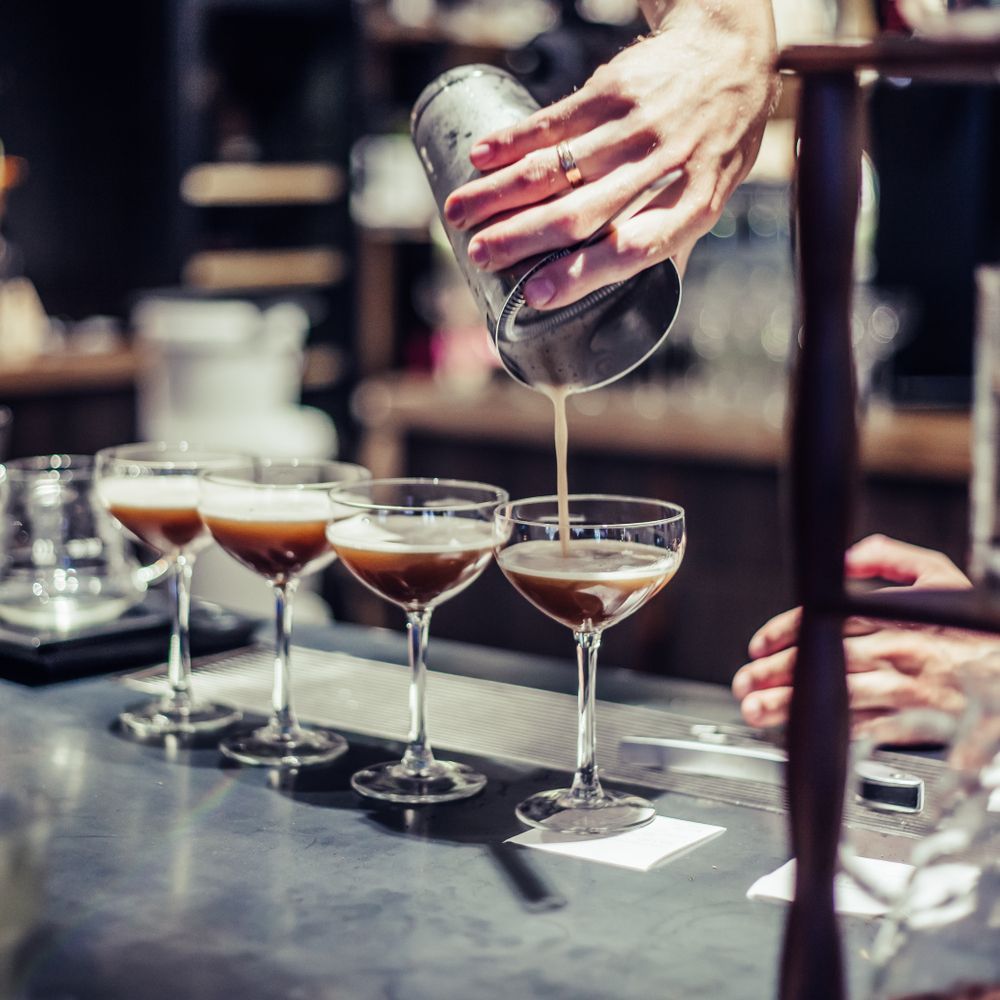 A Bartender Pours a Drink Into a Martini Glass — Mumbo's Pizza'n'Pasta In Lismore, NSW