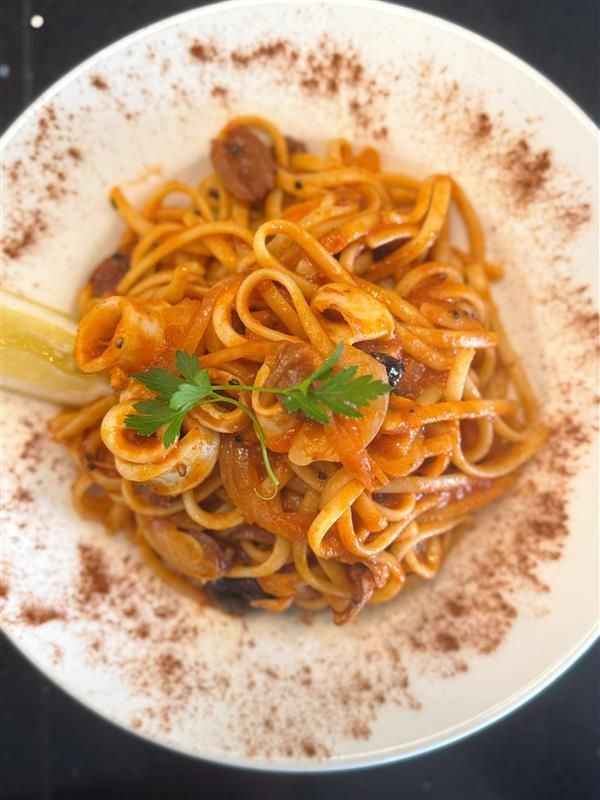 A Row Of Colourful Cocktails Sitting On A Wooden Bar — Mumbo's Pizza'n'Pasta In Lismore, NSW