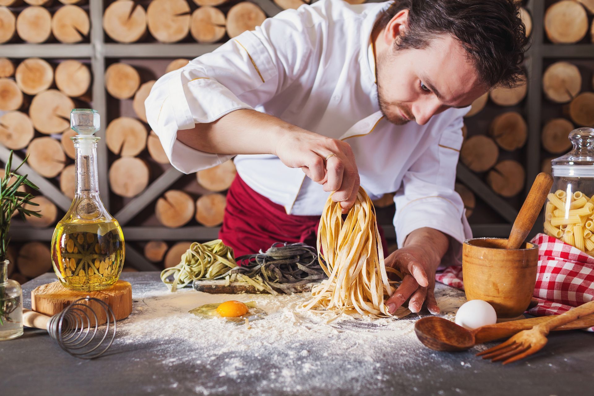 A Chef is Preparing Noodles in a Kitchen — Mumbo's Pizza'n'Pasta In Lismore, NSW