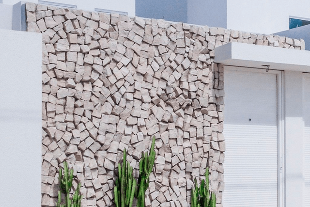 Um muro de pedra com um muro de pedra com textura de pedra.