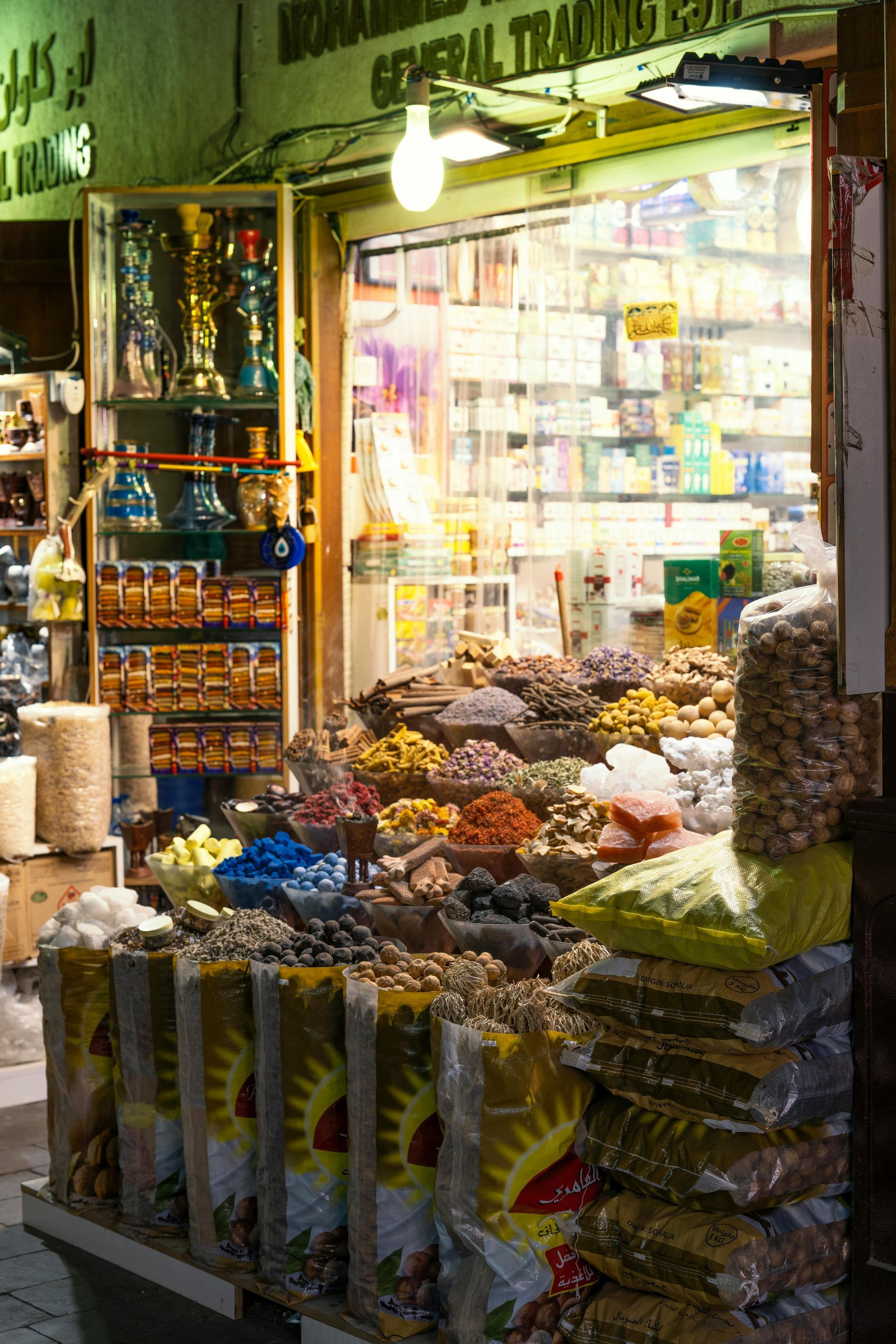 Bustling street in Old Delhi with flags and wires, representing historical landmarks like Red Fort and Chandni Chowk