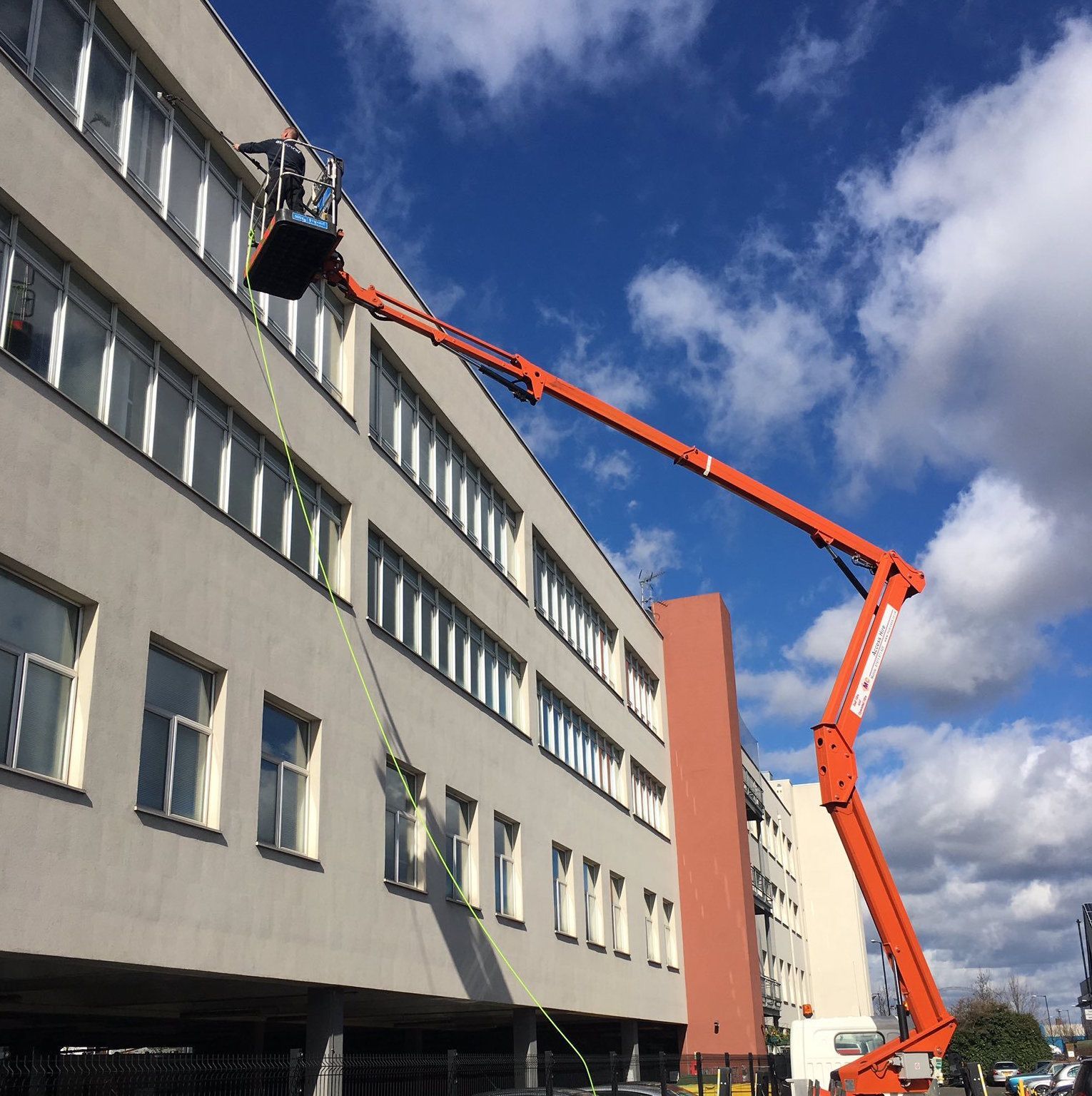 High Level Commercial window cleaning in horsham with a boom lift