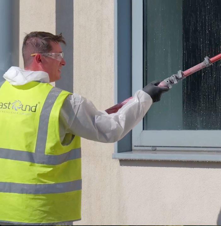 Commercial render cleaning before and after on NHS hospital facade - soft wash method by Astound Cleaning Group