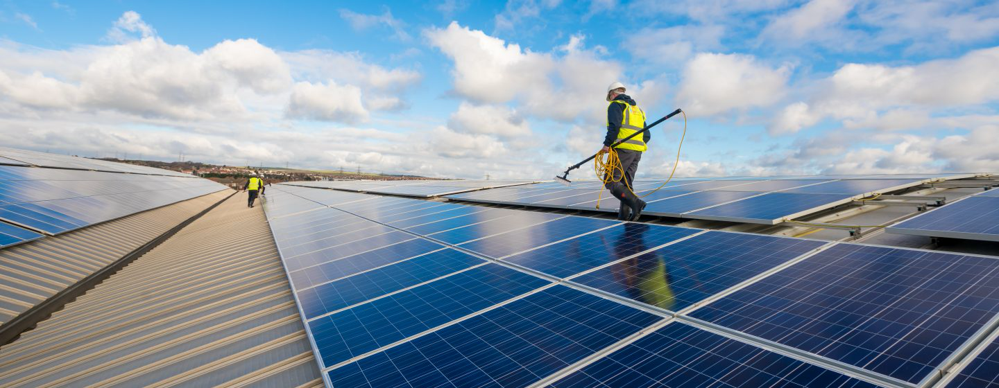 Astound Cleaning Group pure water solar panel cleaning on a commercial rooftop array — restoring generation efficiency, Sussex & South London