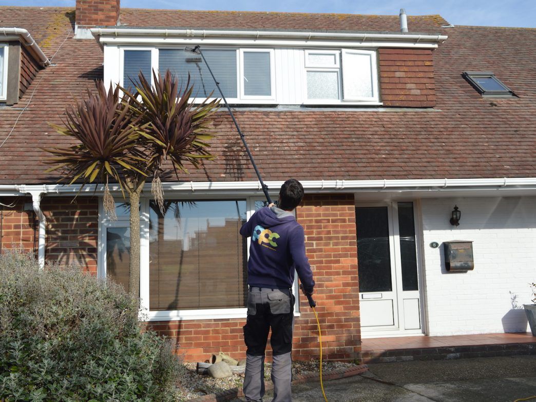 Professional residential window cleaning on a modern home