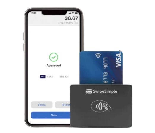 Smartphone displaying payment approval, card swiped through a SwipeSimple reader.