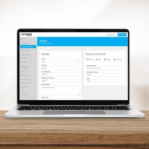 Laptop showing a blue and white online invoice form with details and payment options.