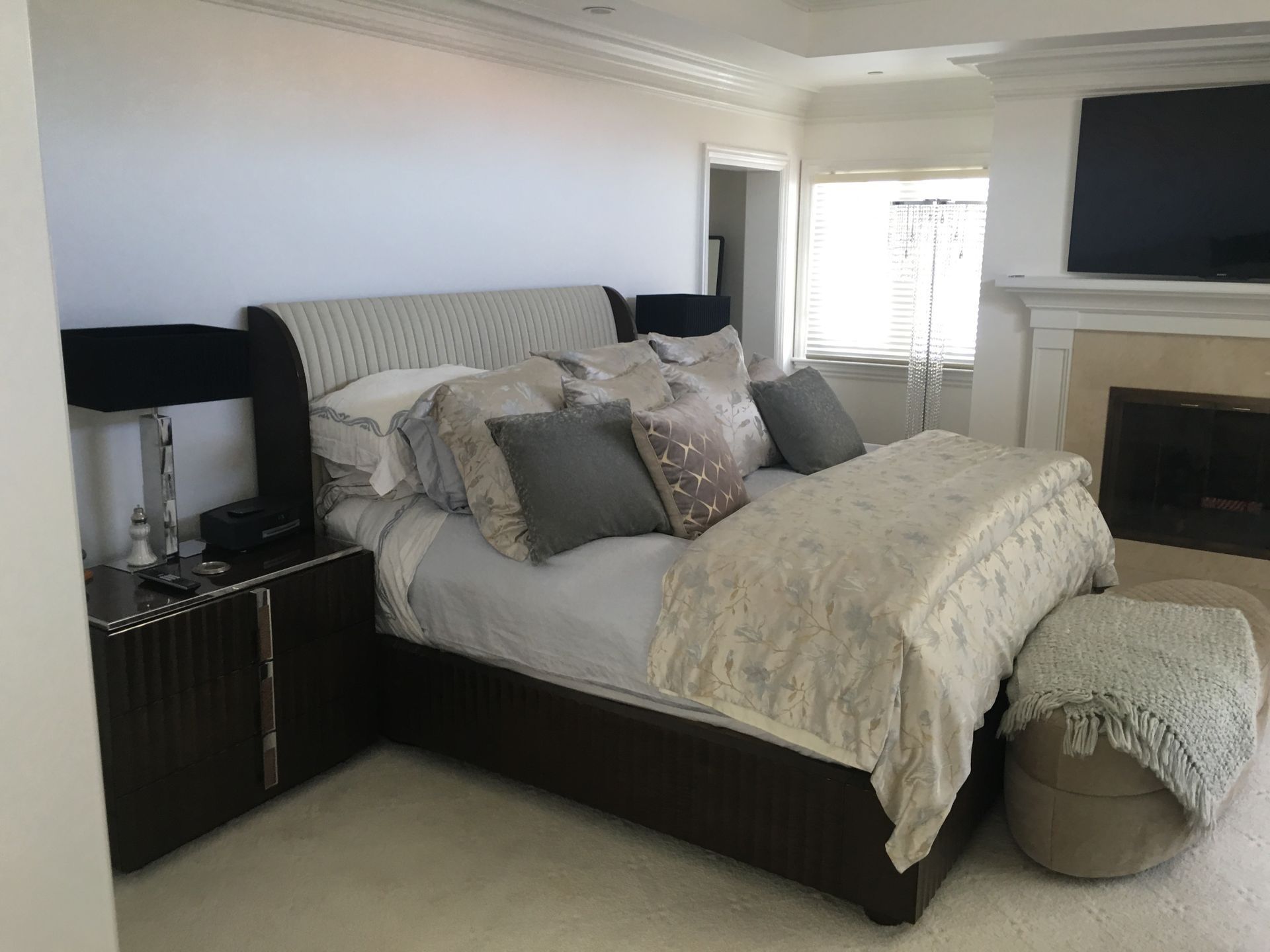 Bedroom With Large Bed and Fireplace