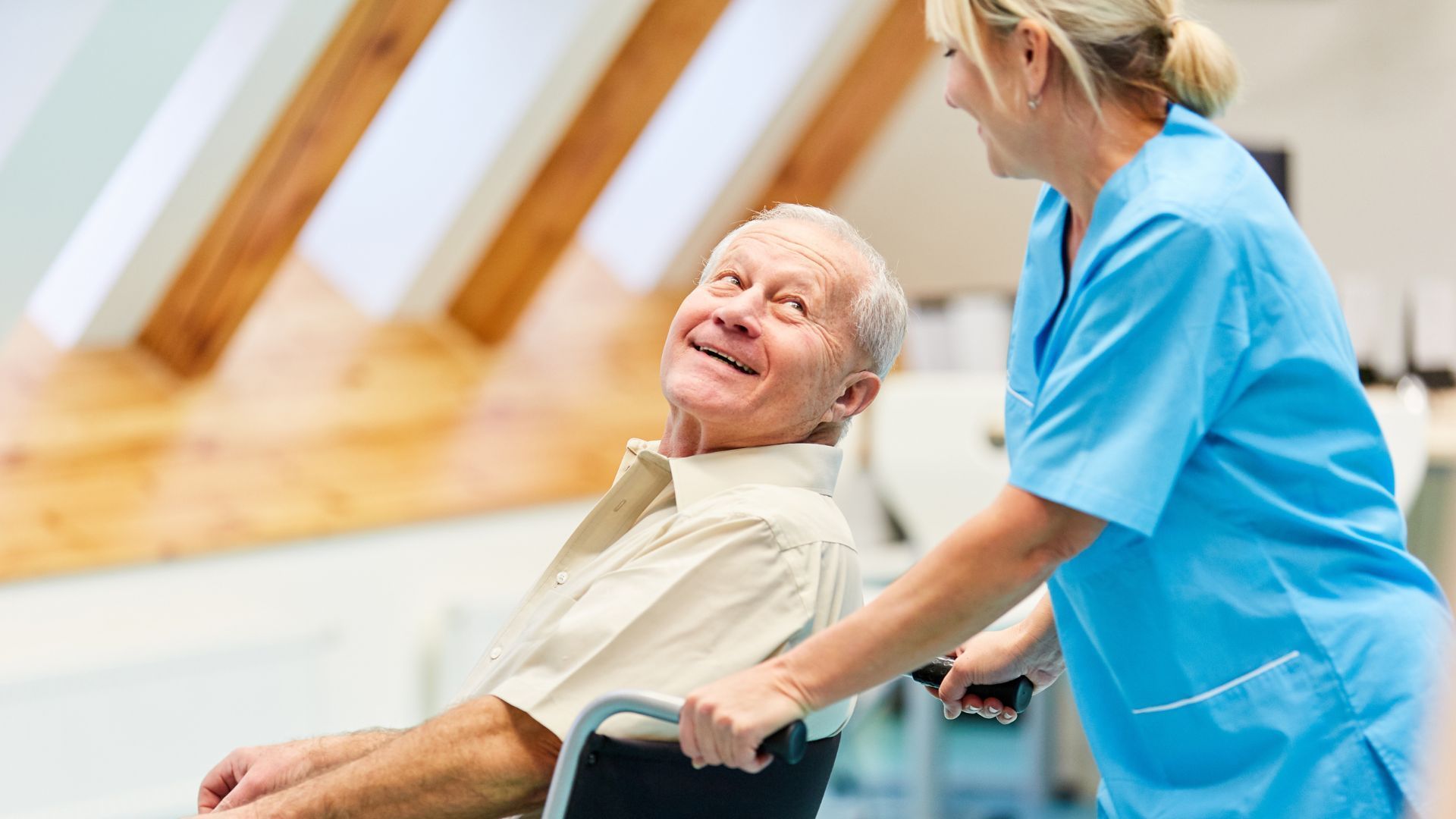 elderly_man_in_wheelchair_with_nurse