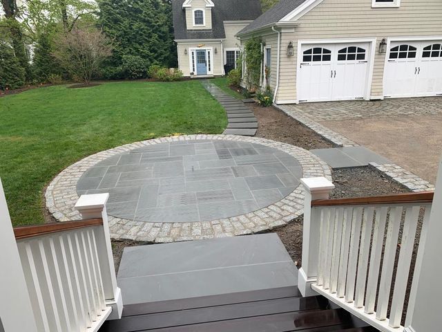 A house with a circular patio in front of it