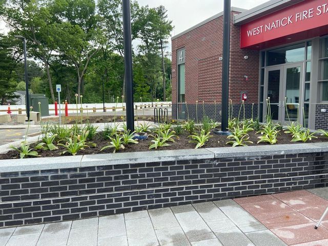 A building with a sign that says west natick fire station