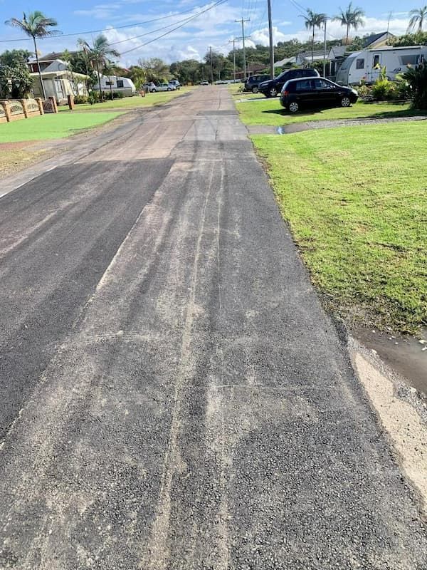 Car is Parked on the Side of a Road Next to a Grassy Area — JP Civilworx Pty Ltd in Mid North Coast, NSW