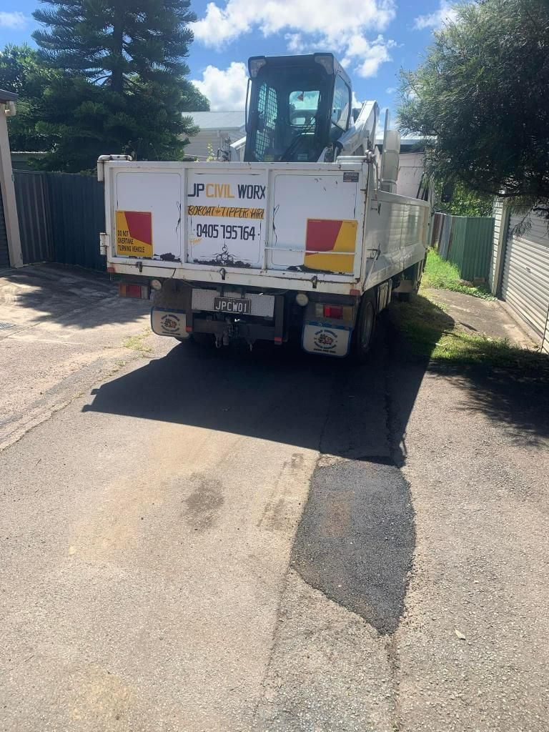 White Truck is Parked on the Side of the Road — JP Civilworx Pty Ltd in Newcastle, NSW