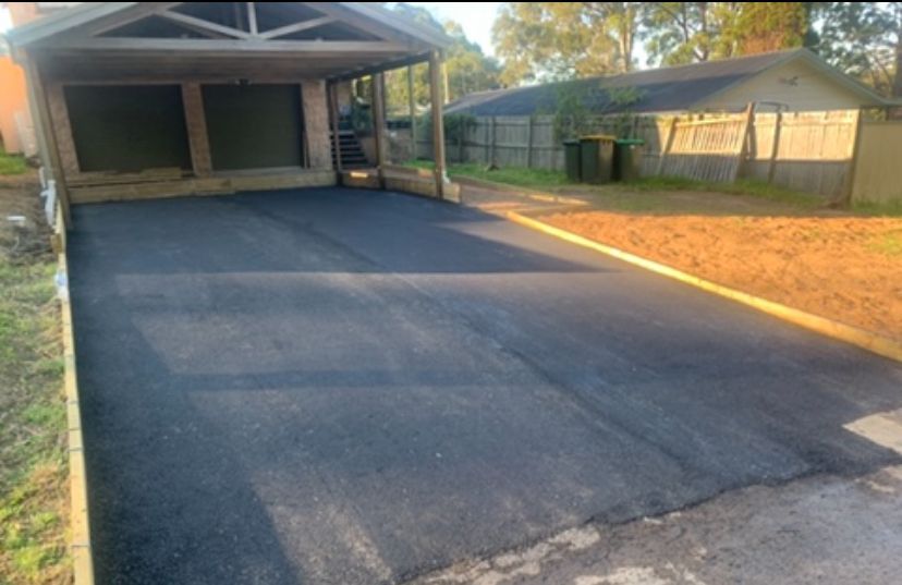 A Driveway Next To Some Grass And Three Bins — JP Civilworx Pty Ltd in Eraring, NSW