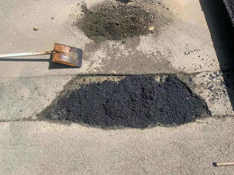 Shovel is Laying on the Ground Next to a Patch of Asphalt — JP Civilworx Pty Ltd in Singleton, NSW