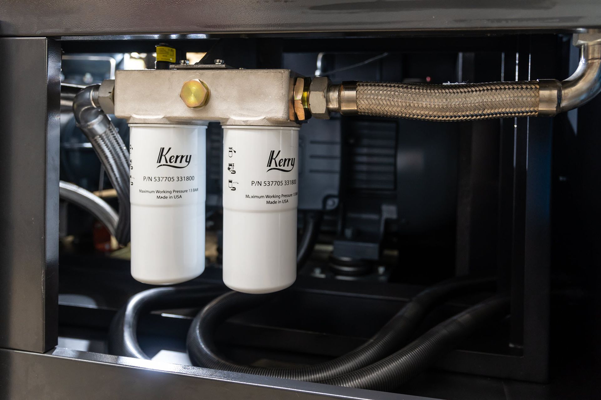 A close up of a machine with two filters and a hose