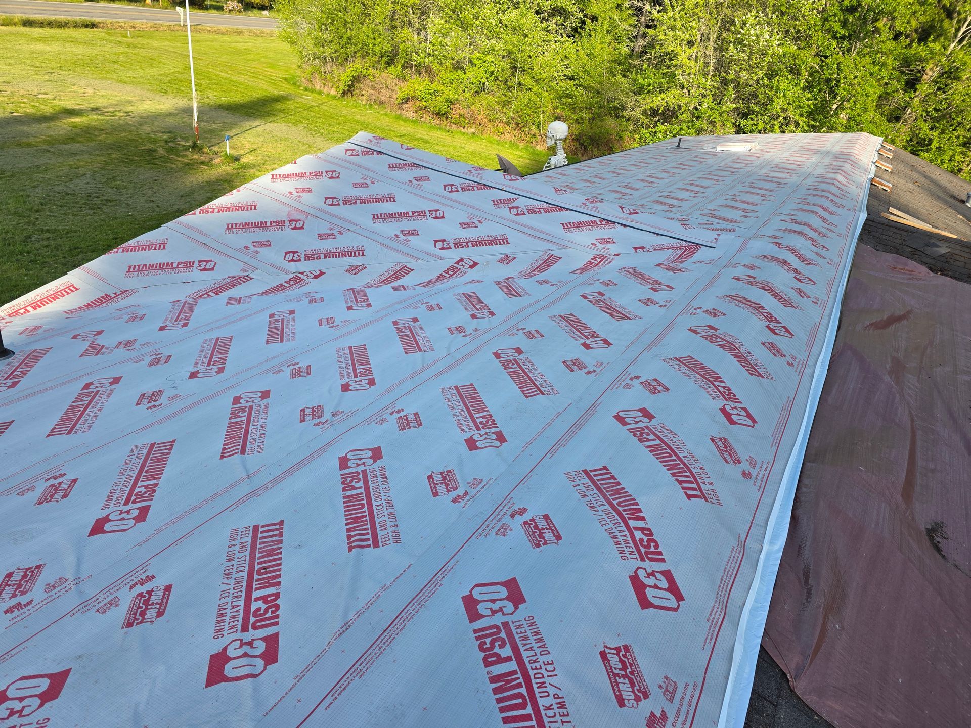 A roof with a lot of red and white sheets on it