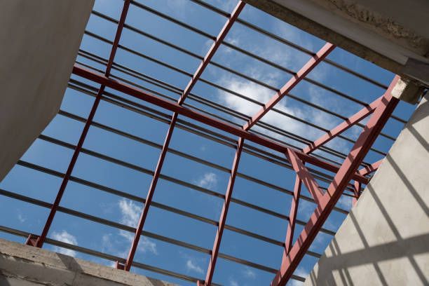 A house with a gray roof and two windows on the roof.