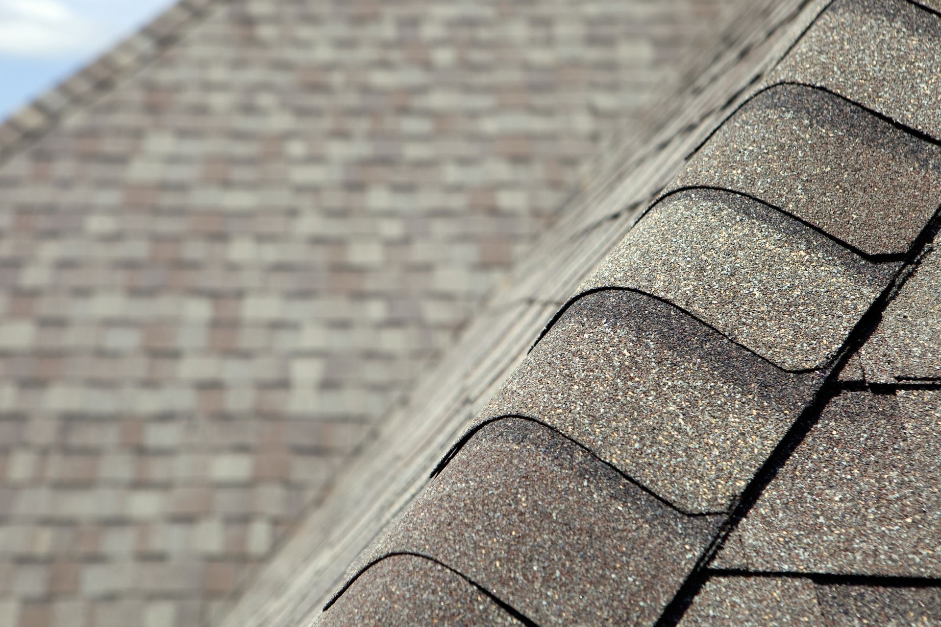 A close up of a roof with shingles on it.