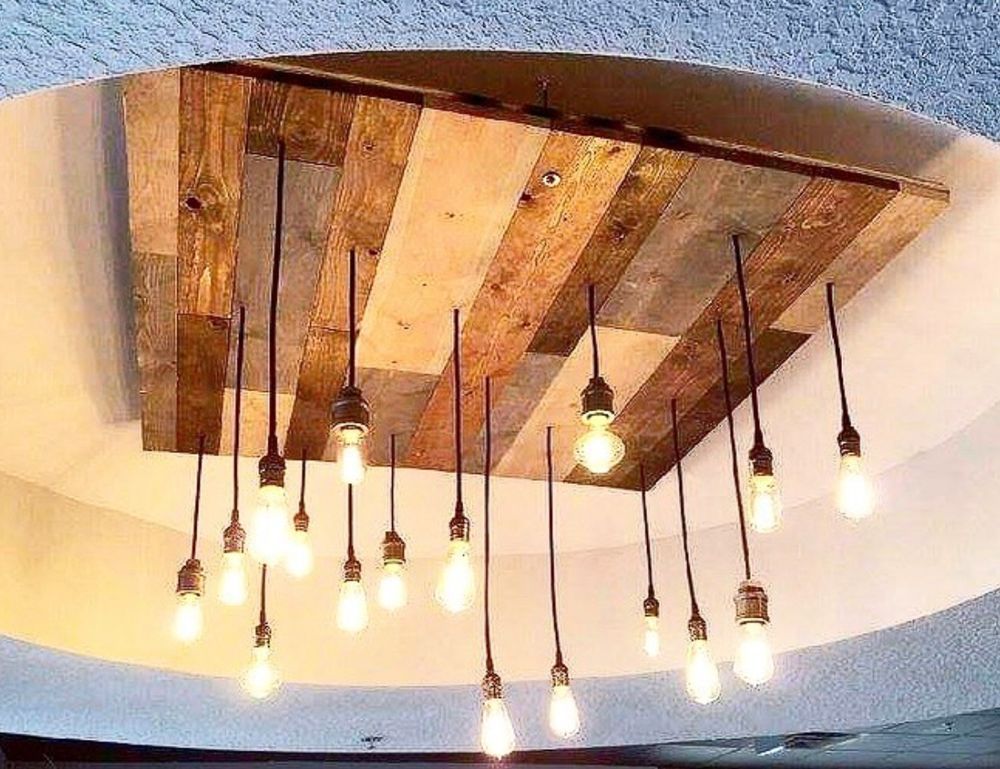 A rustic wooden ceiling light fixture with dangling Edison bulb lights.