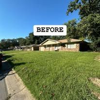 A before picture of a house with a lot of grass.